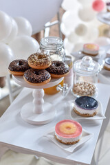 donuts and cakes with balloons