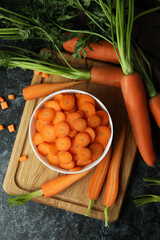 Concept of fresh vegetable with carrot on black smokey table