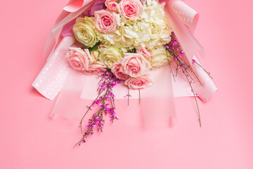 bouquet of flowers on pink background  - image