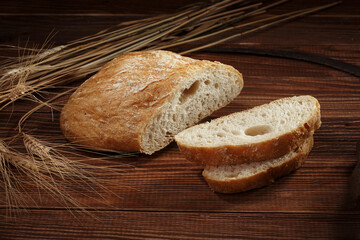 Sliced ciabatta on a brown background