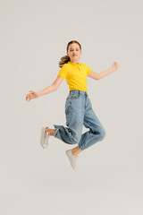 Caucasian girl isolated on white studio background. Copyspace. Childhood, education, emotions concept