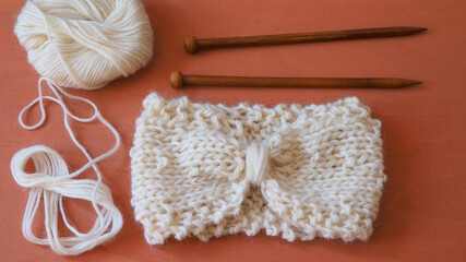 hand knitting headband project with wooden needles 