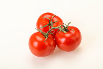 Red bright ripe tomato branch