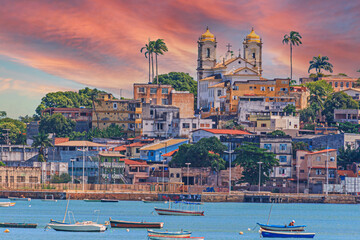Panoramic view of the old town of Salvador de Bahia from the opposite coast in the afterglow - obrazy, fototapety, plakaty