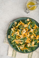 Raw Healthy Kale Winter Salad with Oranges and Pumpkin Seeds Chicken and Cheese