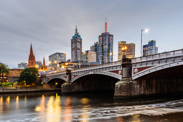 Princes Bridge and city buildings on the Yarra River in Melbourne, Australia in the evening - 2021