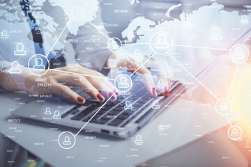 Double exposure of woman hands typing on computer and social network theme hologram drawing. People media concept.