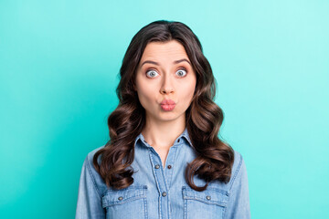 Fototapeta premium Photo of flirty cute young woman wear jeans shirt sending you kiss isolated turquoise color background