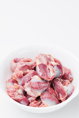 Raw chicken thighs on a white plate on a white background. Mockup