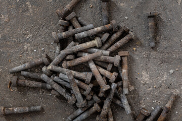 Fototapeta premium iron bolts scattered on the ground.