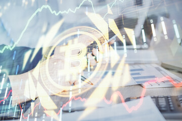 Double exposure of man's hands holding and using a phone and crypto currency blockchain theme drawing.