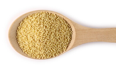 Peeled yellow millet seeds in wooden spoon isolated on white background, top view