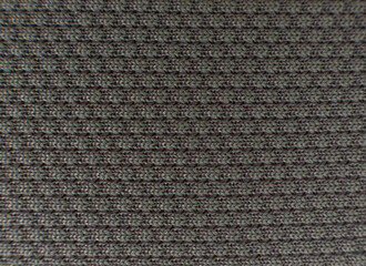 The background is made of natural fabric with a pattern. Fine texture of the fabric. Suitable for your text or logo. Top view. Copy space.
