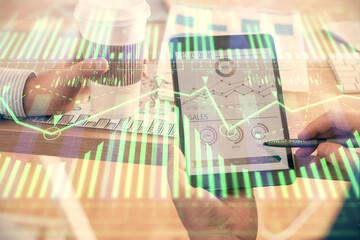 Multi exposure of man's hands holding and using a digital device and data theme drawing. Innovation concept.