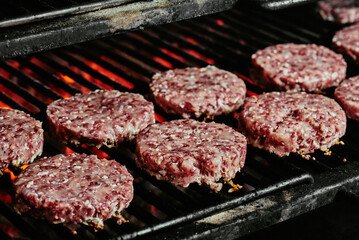 raw burger cutlets - cutlets made from organic beef on a grill. raw cutlets. 