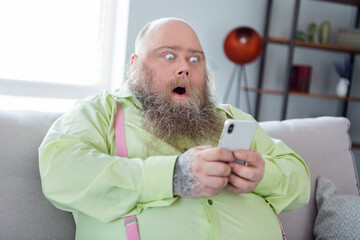 Portrait of impressed person open mouth staring phone cant believe bad fake news blog post sit on...