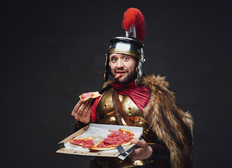 Amazed military roman with pizza slice and box