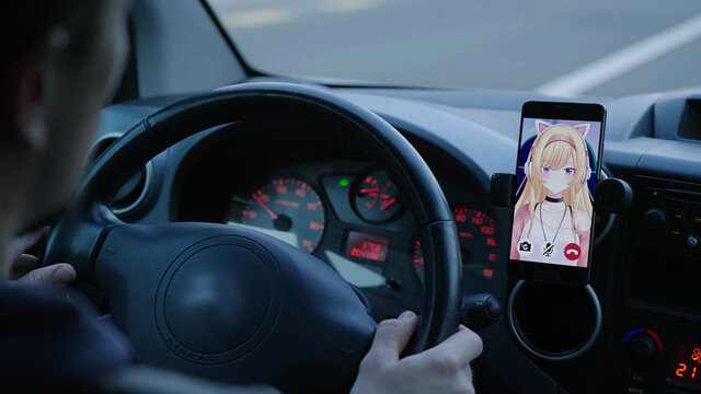 Driving on street while on video call with virtual girlfriend on smartphone