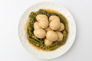 Sauce of quail eggs on a white background