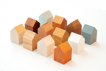 Group of similar miniature wooden houses.