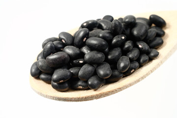Beans in a wooden spoon