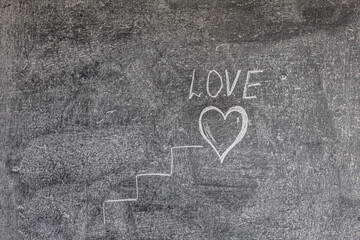 steps to a small heart that is drawn on the board with chalk. concept of love. romance.