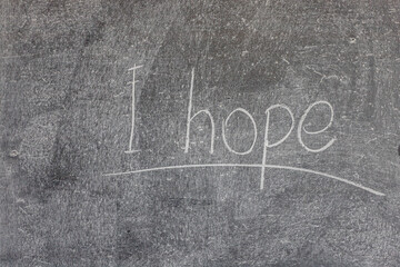 I hope. words written in chalk on a blackboard.