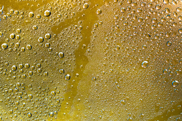 Water droplets and cold vapor on the orange clear glass