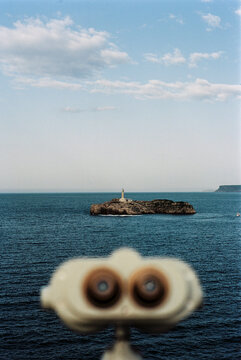 binoculars in a viewpoint looking at an island