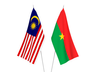 National fabric flags of Malaysia and Burkina Faso isolated on white background. 3d rendering illustration.