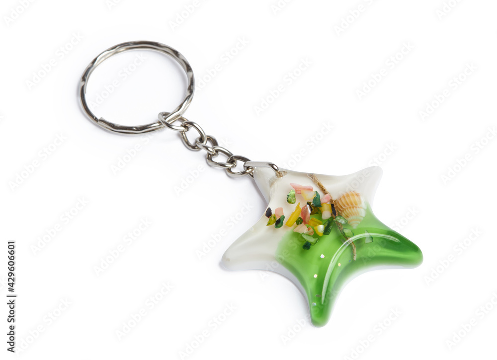 Wall mural Epoxy resin key ring in a star shape with sea shells isolated on a white background with clipping path