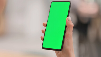 Holding Smartphone with Green Chroma Key Screen