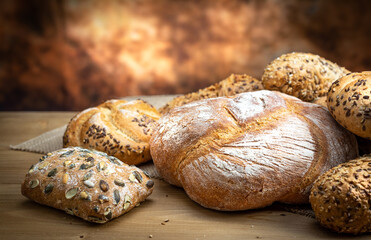 Fresh bread and pastry on wooden background