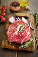 Raw beef steak on cutting board