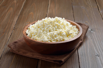 Cottage cheese in wooden bowl
