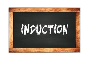 Fototapeta premium INDUCTION text written on wooden frame school blackboard.