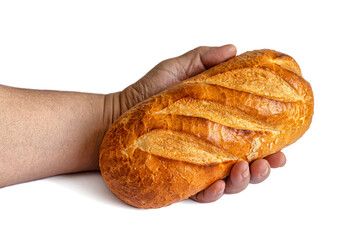 Loaf of bread with a golden crust in a man's hand on a white