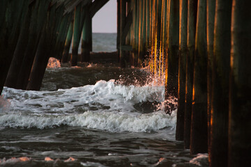 Sunrise under the fishing pier