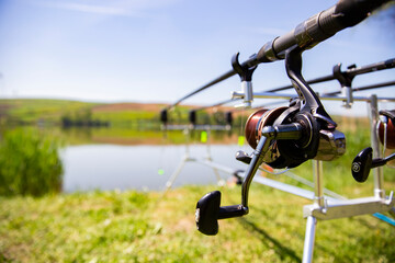 Fototapeta na wymiar Selective focus on professional fishing gear at a lake in action. 