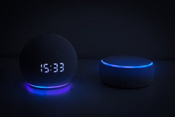 Voice controlled speaker with activated voice recognition, on light background.