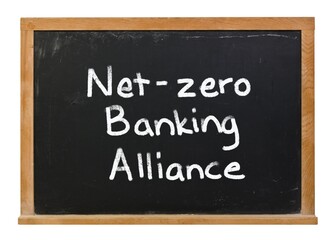 Obraz premium Net zero banking alliance written in white chalk on a black chalkboard isolated on white