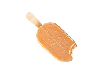 Bitten ice cream in caramel glaze on a wooden stick isolated on white