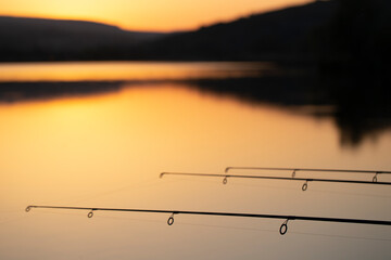 Selective focus on professional fishing gear at a lake in action.