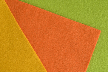 Fototapeta premium Orange, green and yellow felt fabric texture for background.