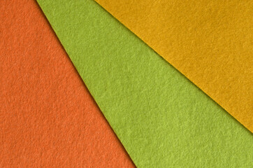 Orange, green and yellow felt fabric texture for background.