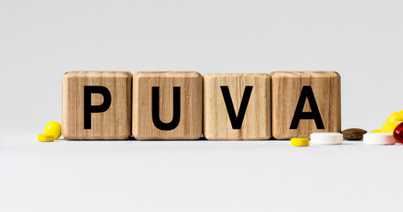 cubes with the word PUVA on them. Care concept.