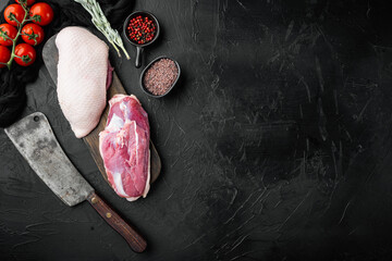Fillet of duck uncooked, raw meat  with old butcher cleaver knife, on black stone background, top view flat lay, with copyspace  and space for text