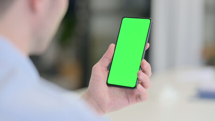 Young Man using Smartphone with Chroma Screen 