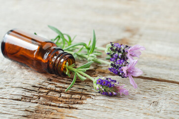 Small bottle with essential oil and lavender flowers. Aromatherapy, homemade spa, beauty treatment...