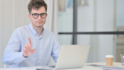 No Gesture with Finger by Young Man at Work 